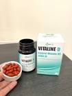 Viên Vitaline D màu hổ phách nhỏ xíu trên nắp lọ